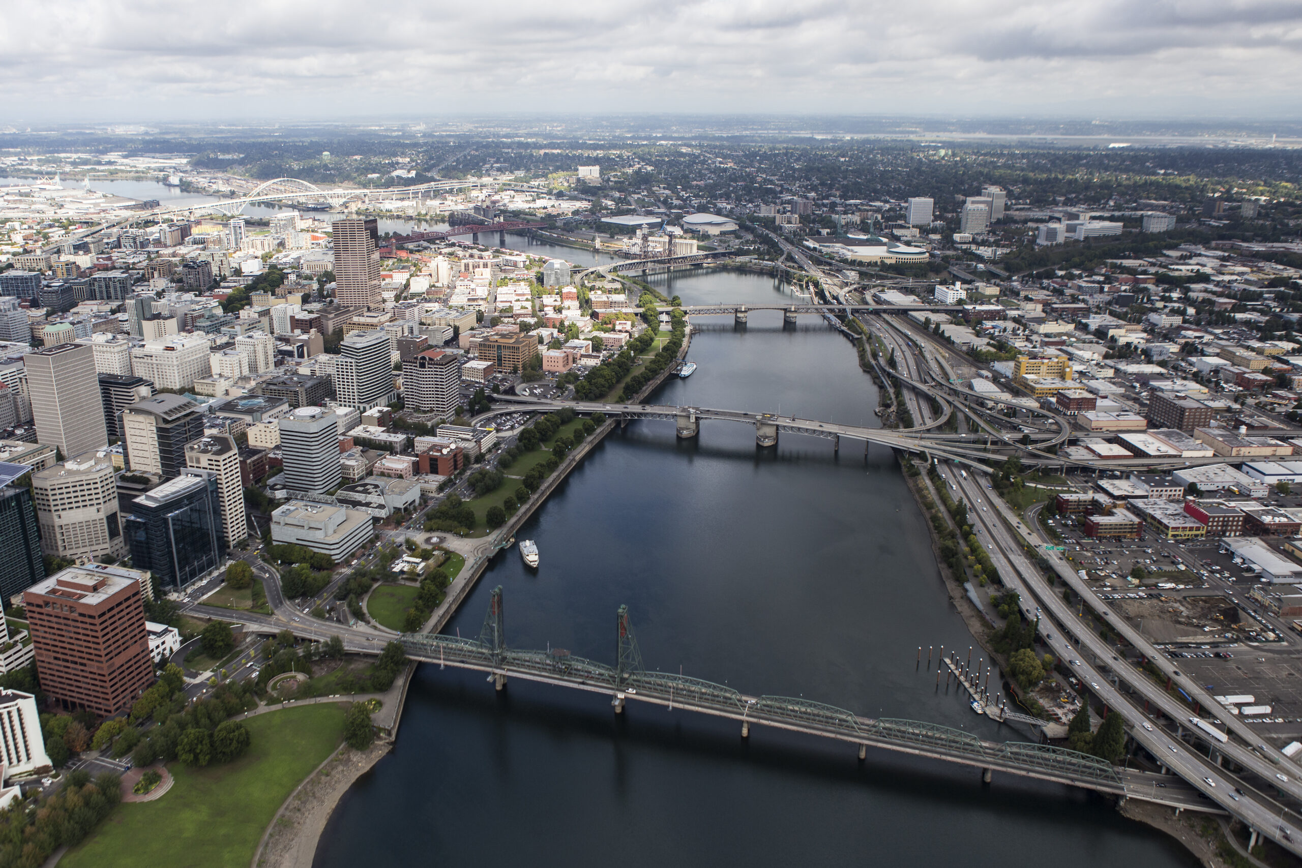 Aerial view of the Willamette River with bridges spanning downtown and central eastside.