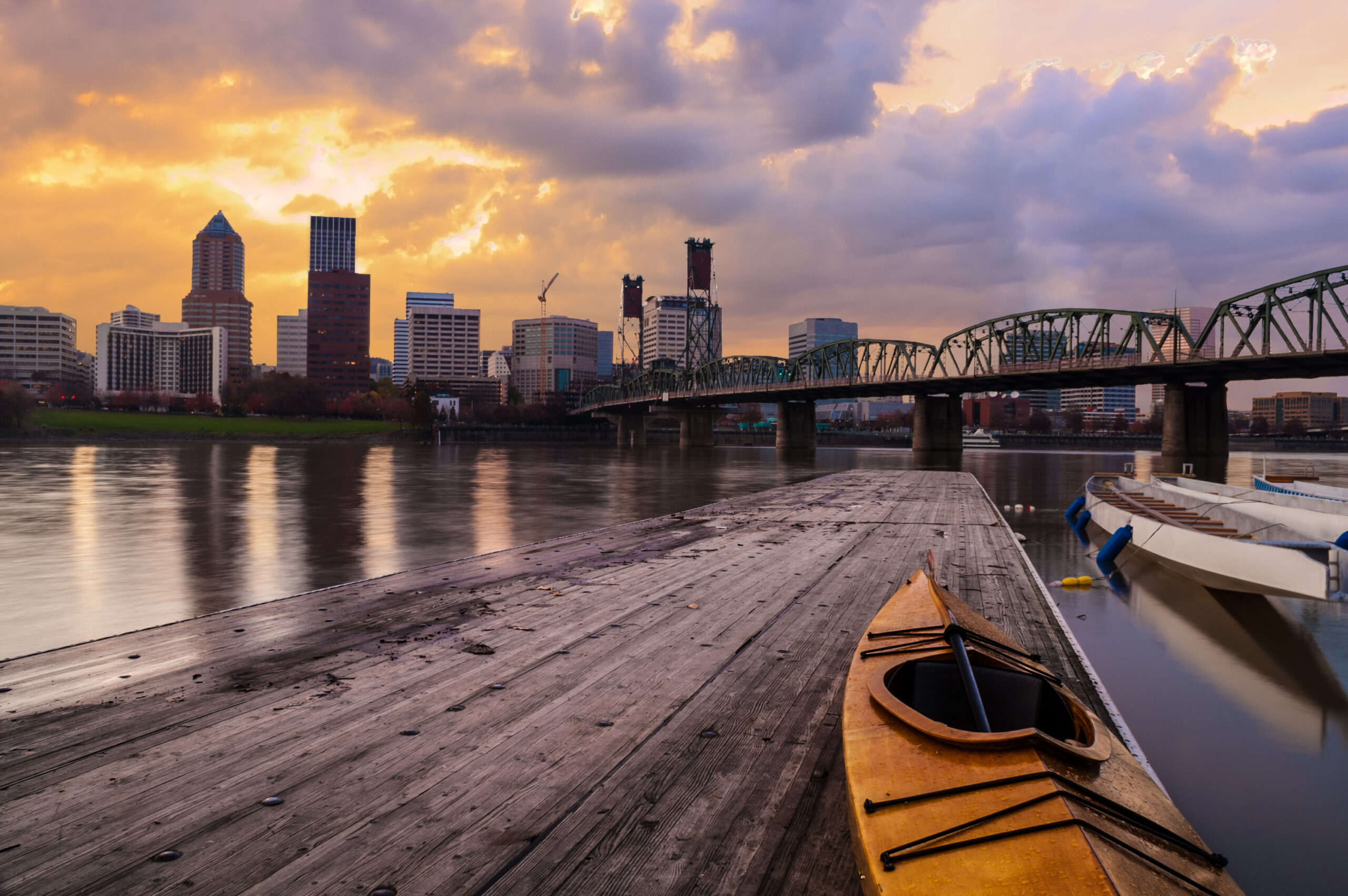 ortland, Oregon Panorama. Sunset scene with dramatic sky and light reflections on the Willamette River.